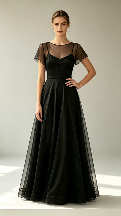 Black A-line tulle maxi evening gown, sheer round neck overlay, flutter short sleeves, satin inner slip, floor-length formal skirt