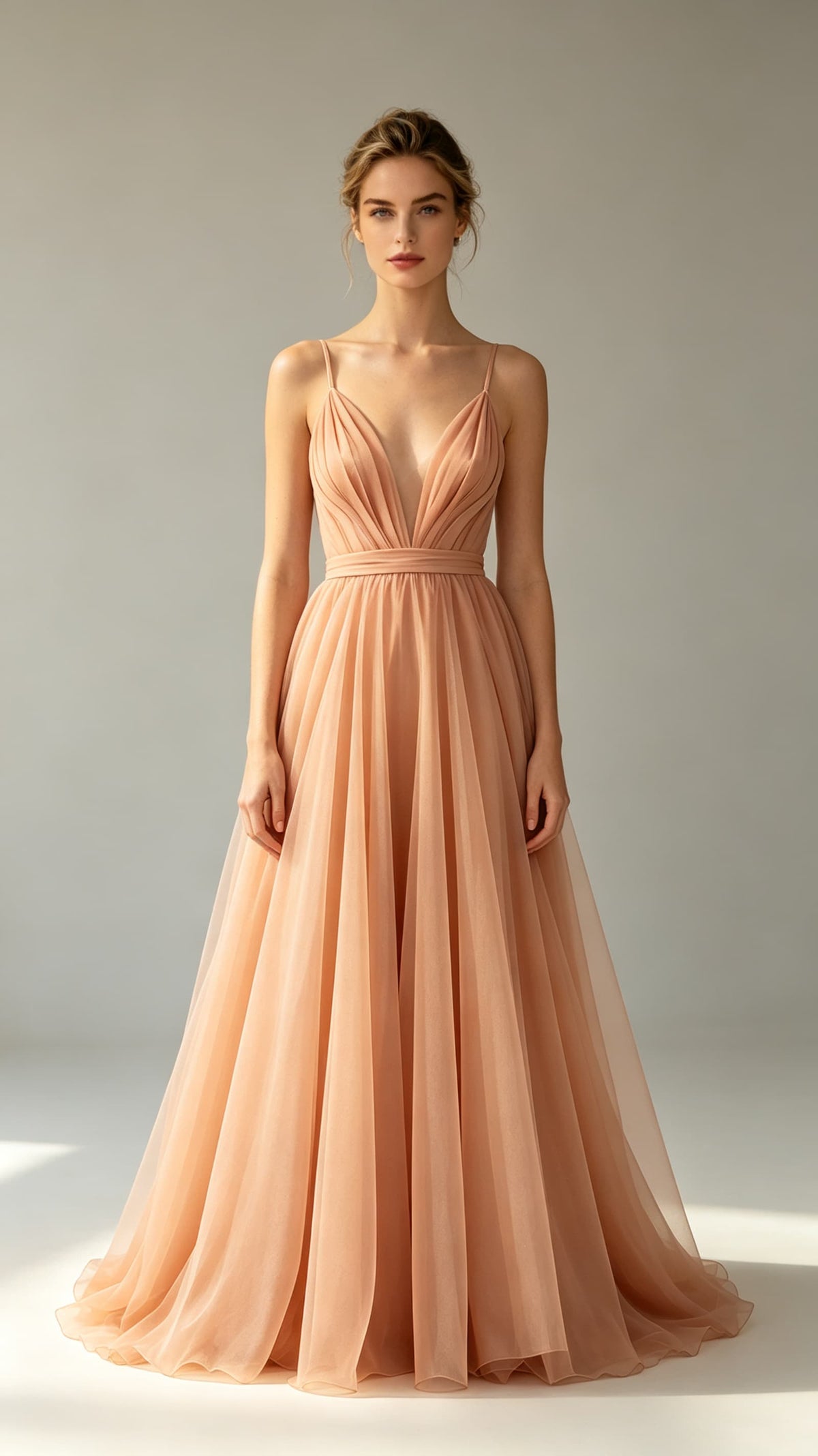 Polished orange A‑line tulle maxi evening gown, thin spaghetti straps, deep V neck, folded waistband, flowing formal skirt