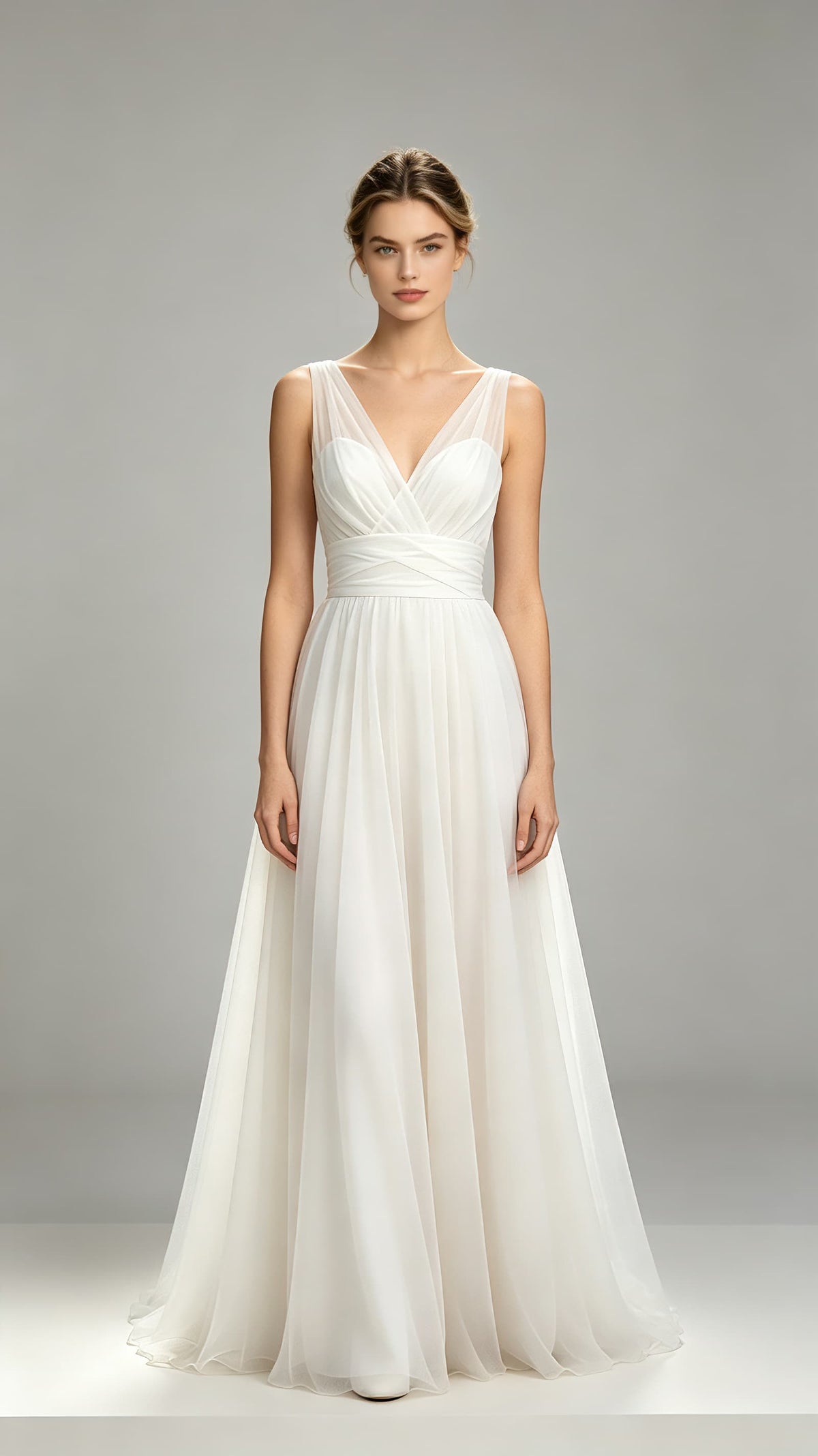 Flowing white A‑line tulle maxi formal gown, sheer wide shoulder panels, wrap v‑neck, crossover waistband, floor‑length airy skirt